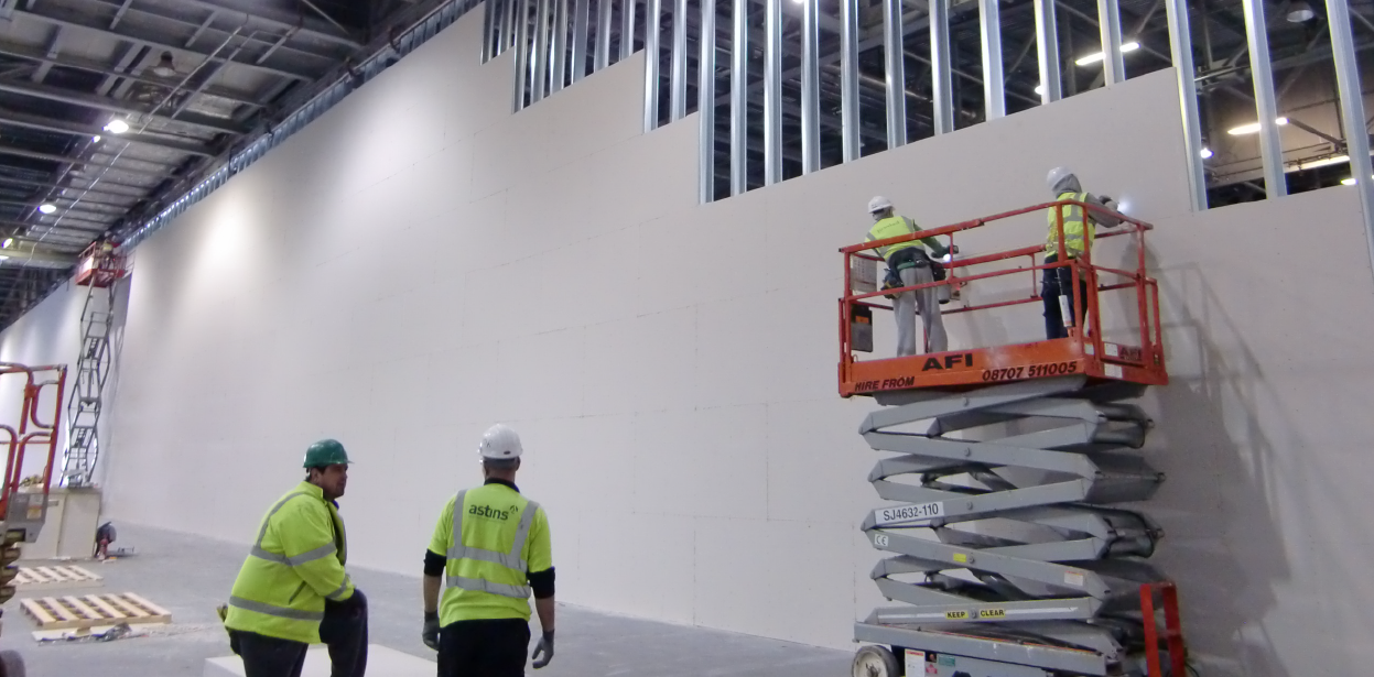 Large banner image showing the London Olympics 2012 Partition Wall being installed.